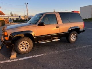 Two-tone Chevrolet K5 Blazer parked on a street